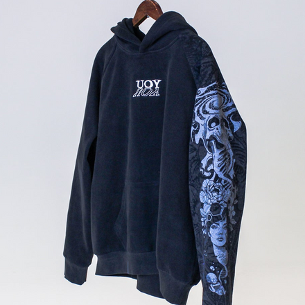 Black hoodie with floral sleeve design on a white background