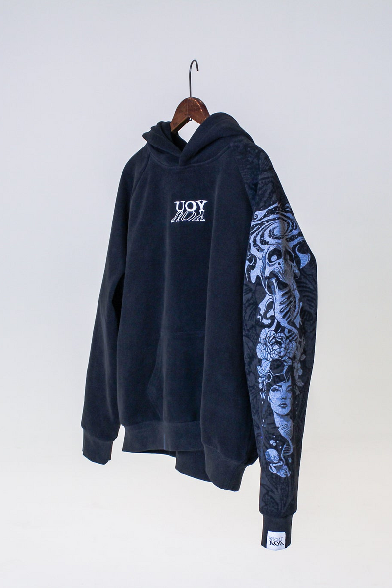 Black hoodie with floral sleeve design on a white background