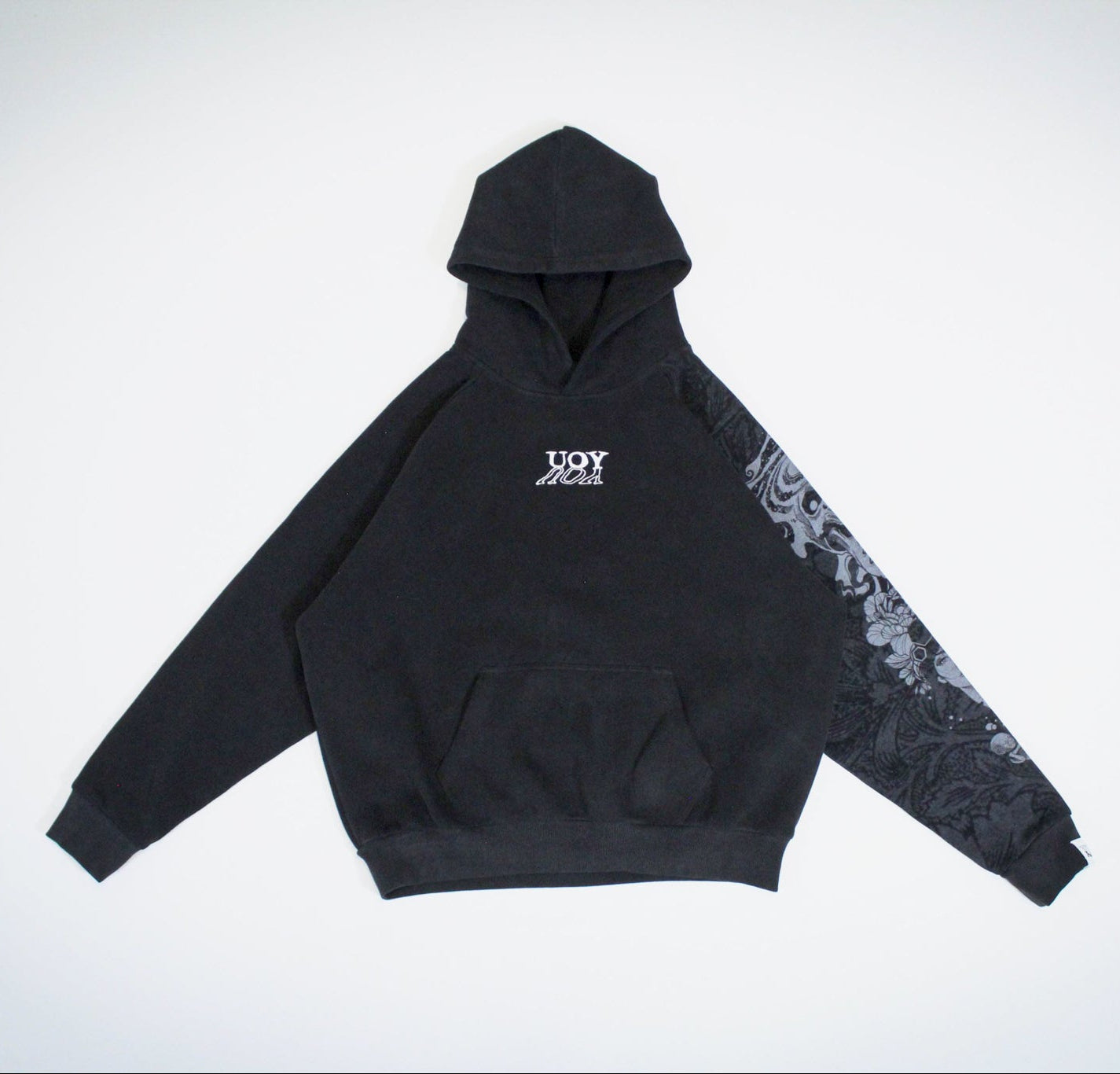 Black hoodie with floral sleeve design on a white background